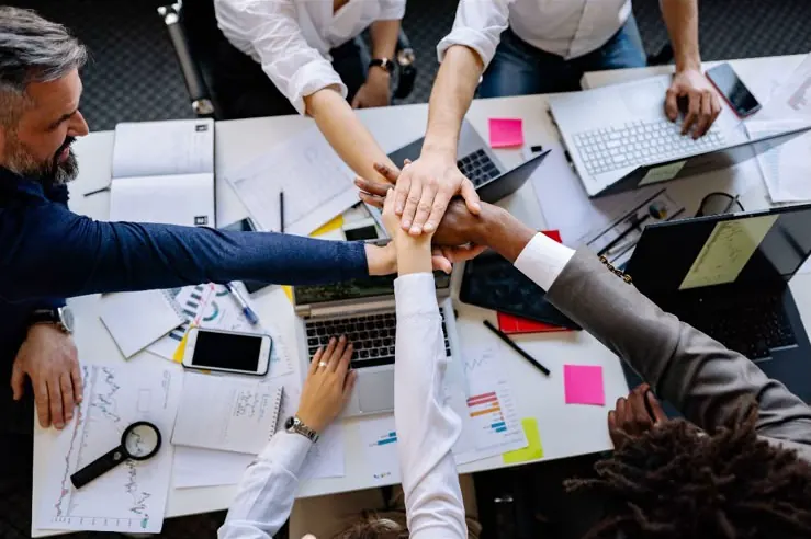 Professional legal team collaborating around a work table